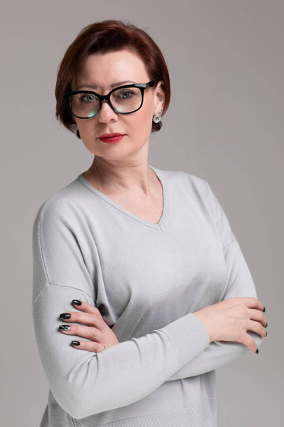 Portrait of beautiful woman with glasses isolated on light background - Fotografie, Obrázek