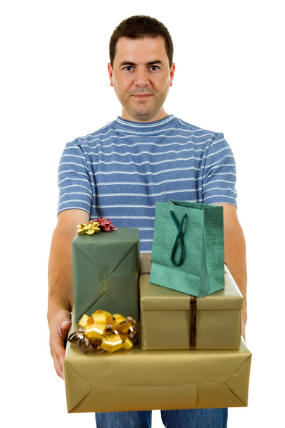 Молодий випадковий чоловік тримає кілька подарунків, ізольований
 - Фото, зображення