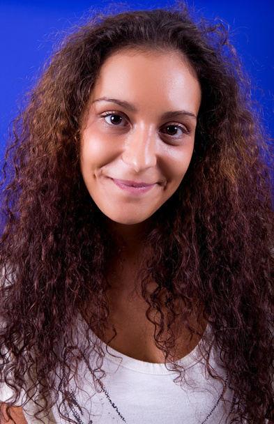 Young beautiful woman, on a blue background - Foto, immagini