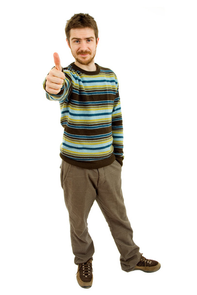 Young casual man going thumb up in a white background - Photo, Image