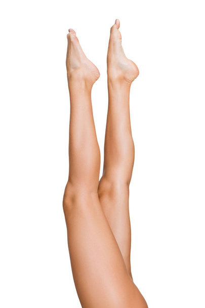 Beautiful woman lifting her legs up in air - Foto, imagen