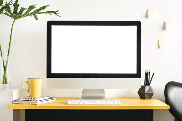 Minimalistic workplace with blank screen and office accessories  - Zdjęcie, obraz