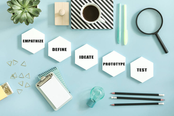 Creative desk with white mock up hexagon shapes of diagram on pastel background  - Фото, изображение