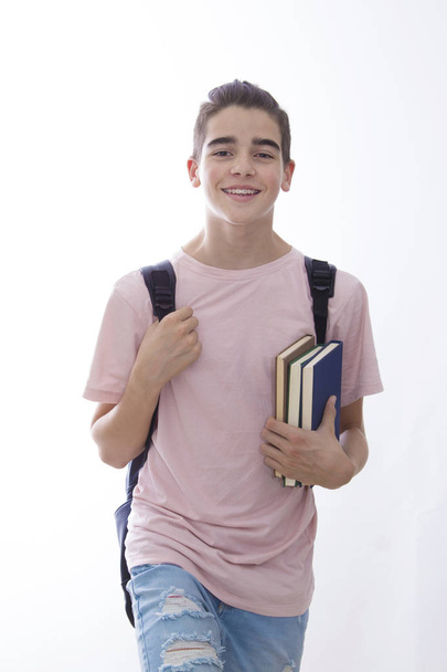 Student mit Büchern und Rucksack isoliert auf weißem Hintergrund - Foto, Bild