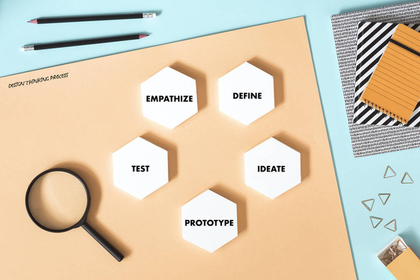 Creative desk with white mock up hexagon shapes of diagram on pastel background  - 写真・画像