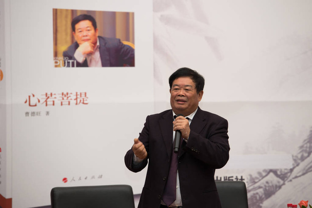 Cho Tak Wong (Cao Dewang), Chairman of Fuyao Group and Chairman of Fuyao Glass Industry Group Co., Ltd., speaks at a press conference for his book in Beijing, China, 17 December 2014 - Zdjęcie, obraz