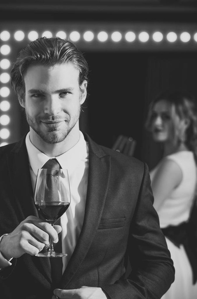 businessman hold wine glass, meeting and relax - Foto, afbeelding