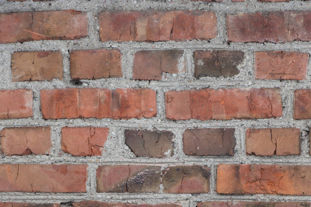 background old brick wall with remnants of plaster	 - Фото, изображение