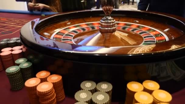 Casino theme. roulette in motion, white ball spinning. Bad luck and Good luck concept. Roulette wheel running. City nightlife entertainment. Dealer hand moves the roulette. hd - Footage, Video