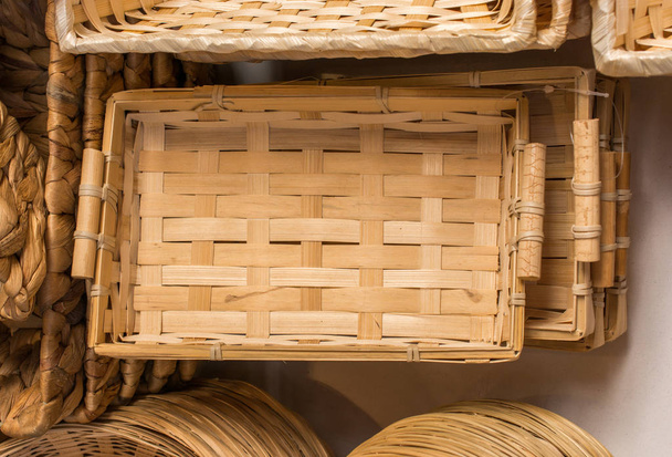 Empty wicker baskets are for sale in a market - Photo, Image