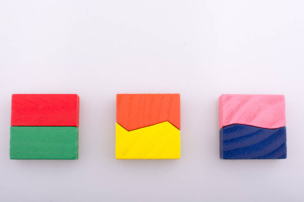 Colorful wooden pieces of a logic puzzle - Фото, изображение