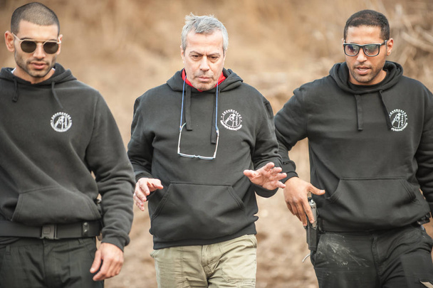 Pozarevac, Serbia - December 21-24, 2018: Kapap Instructor Avi Nardia teaches his students on the shooting range GROM, how to safely use the gun on KAPAP BASIC FIREARMS SAFETY AND GUN USE SEMINAR - 写真・画像