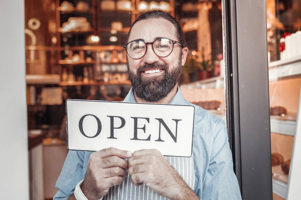 Get started. Entrepreneur feels happy while opening his own cafe - Foto, imagen