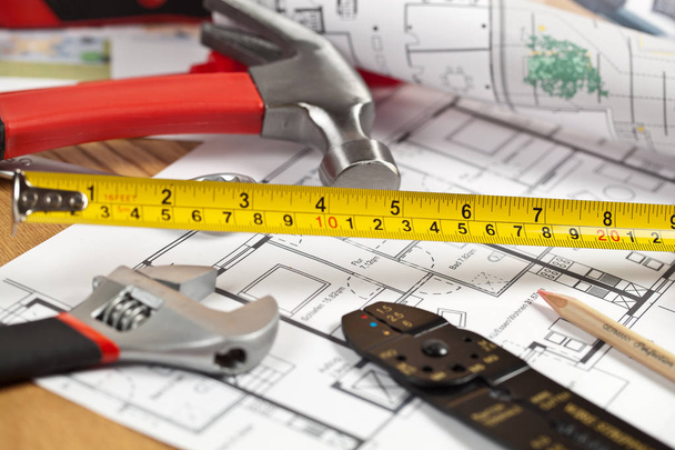 close-up view of blueprint and construction tools on table, maintenance concept - Zdjęcie, obraz