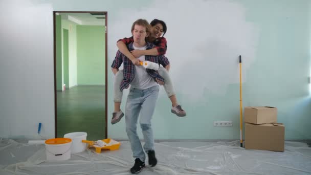 Mischievous couple renovating house interior - Footage, Video