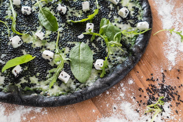 pizza with black caviar - Foto, afbeelding