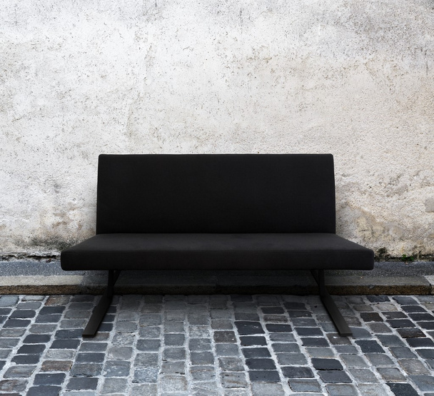modern sofa on cobblestone street - Фото, зображення