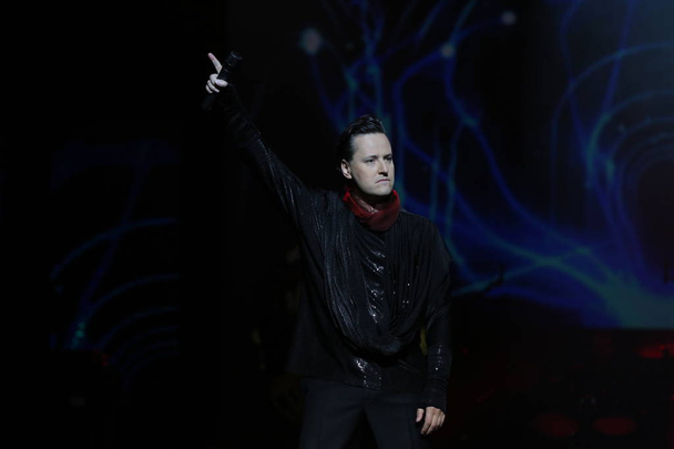 Russian singer-songwriter Vitaliy Vladasovich Grachov, better known by his stage name Vitas, performs at a concert during his China tour in Shenyang city, northeast China's Liaoning province, 4 November 2016.  - Zdjęcie, obraz