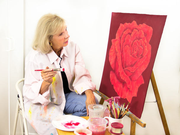 Artist Studies Her Painting of a Rose - Valokuva, kuva
