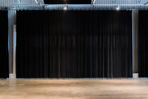 Black movie theater curtains with concrete floors. Empty spare for performance  - Fotó, kép