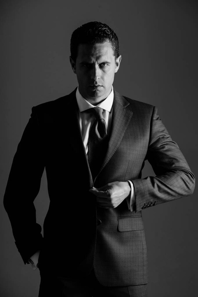 business fashion, businessman buttoning button on elegant blue formal suit - Foto, imagen