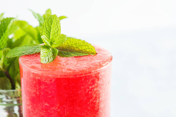 Watermelon beverage with mint decoration, closeup view, copy space - 写真・画像