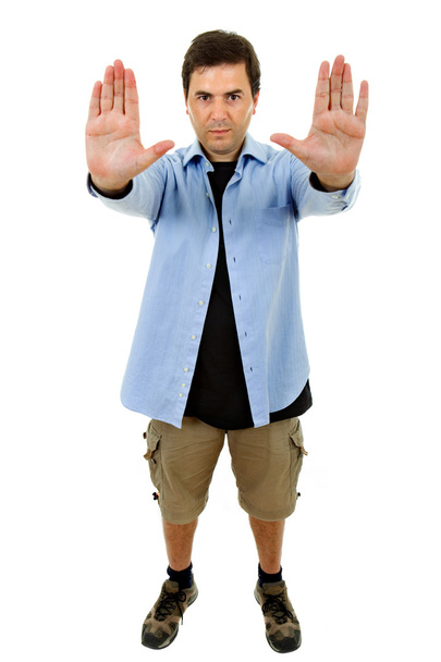 Young casual man going stop with his hands - Photo, Image