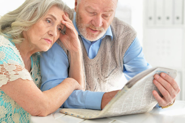 senior couple reading newspaper - Фото, зображення