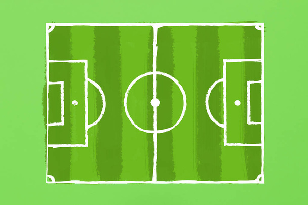 Изображение футбольного поля на зеленой картонке. Тактика игры. Концепция игры в футбол. Плоский, вид сверху
 - Фото, изображение