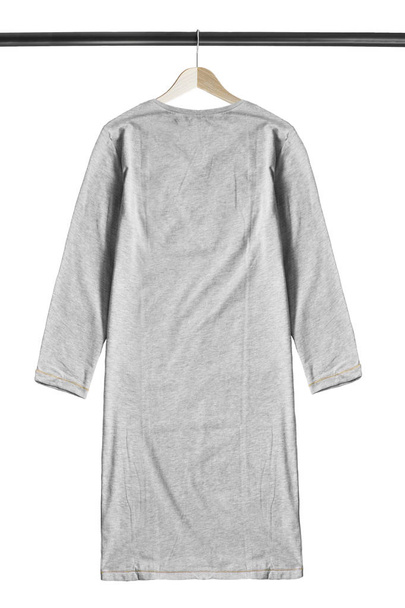 Grey oversized dress hanging on wooden clothes rack isolated over white - Φωτογραφία, εικόνα