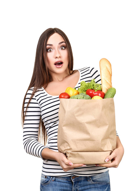 Beautiful woman holding grocery shopping bag on white background - Foto, Imagem