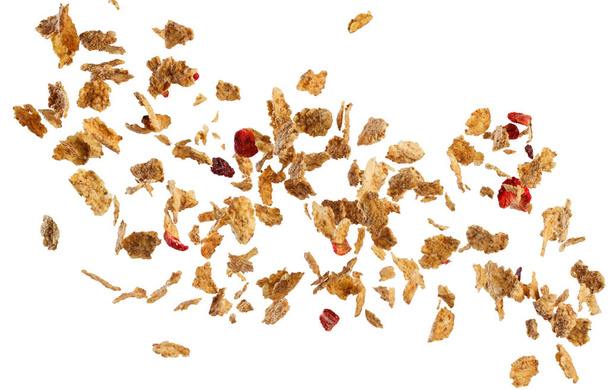 Fallende Cornflakes und Früchte isoliert auf weißem Hintergrund - Foto, Bild