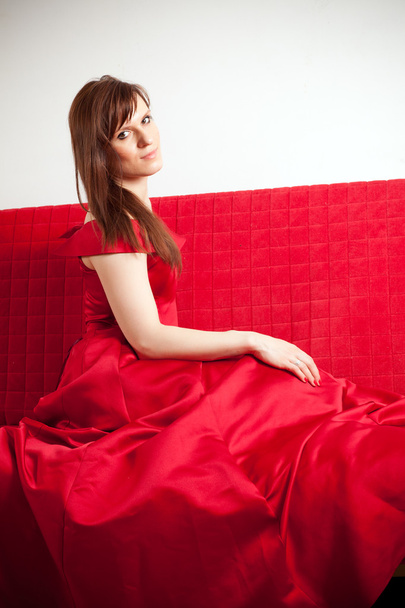 woman in a ball gown on the sofa - Zdjęcie, obraz