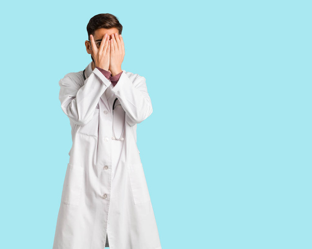 Young doctor man feels worried and scared - Foto, Imagem