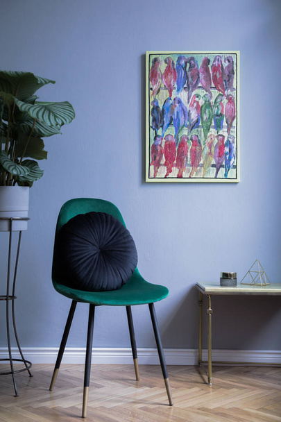 stylish green velvet armchair and colorful picture with parrots  - Photo, Image