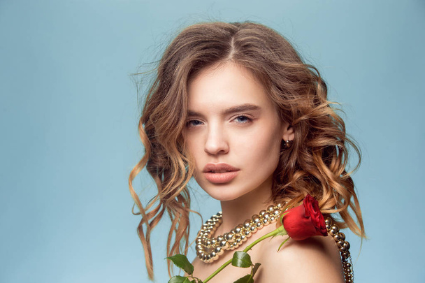 Beautiful young girl in studio with pearl jewelry - earrings, bracelet, necklace. - Photo, image