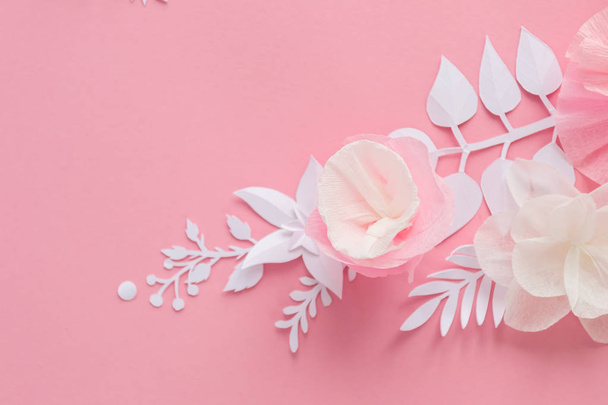 white and pink paper flowers on the pink background. Frame of flower - Foto, afbeelding