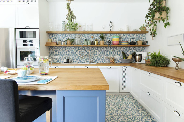 Light stylish kitchen in blue colors in Mediterranean style - Photo, Image