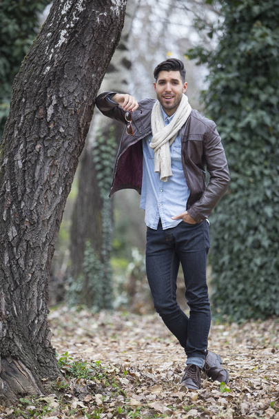 young sexy man posing in forest.autumn day - Foto, imagen