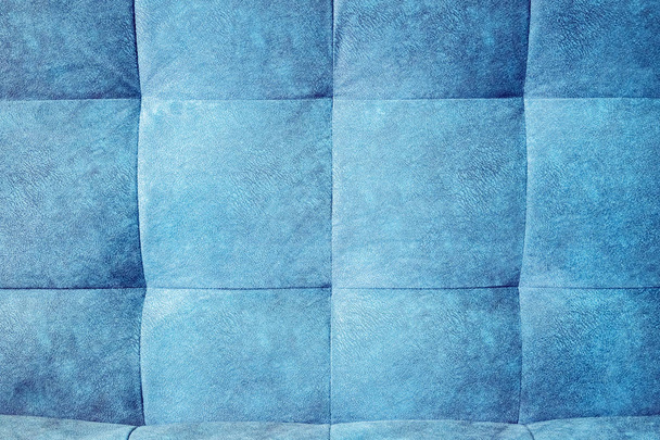 Close-up comfortable blue soft back of the sofa with curly stitching. Modern design - Foto, immagini