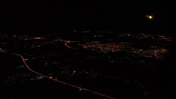 Aerial view of the city lights in the night. - 写真・画像
