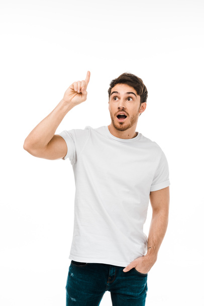 young man with open mouth having idea and pointing up with finger isolated on white - Φωτογραφία, εικόνα