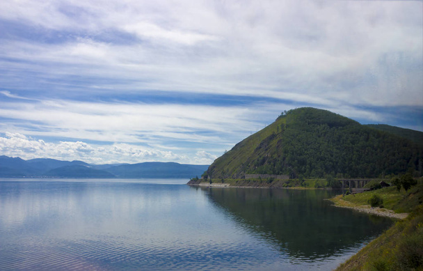 Summer landscape with mountains on lake Baikal. Old bridge on the Circum-Baikal Railway, Siberia - 写真・画像