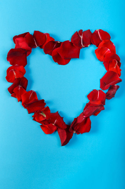 Rose lined heart on a blue background. - Fotó, kép