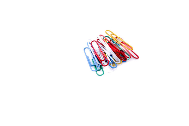 colurful paperclips piled  on a white background - Photo, Image