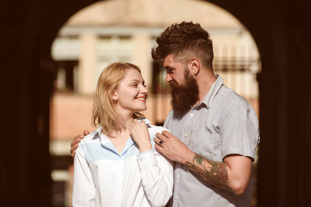 Drowning into her eyes. Bearded man hug sexy girl. Couple in love on summer day. Sensual woman and man enjoy romantic date. Loving couple of woman and hipster dating outdoor. Feeling love and romance - Photo, Image