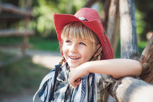 Cowboy girl. little girl in cowboy outfit on the ranch - Фото, изображение