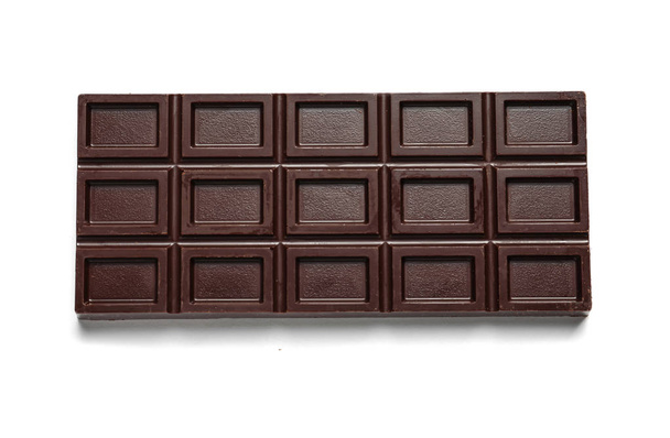Tasty dark chocolate bar on white background, top view - Foto, imagen