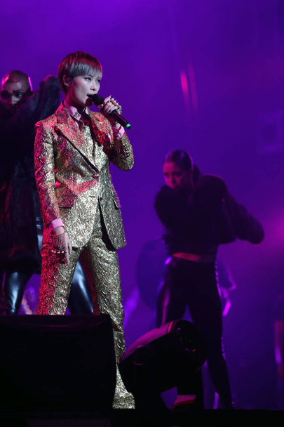 Chinese singer Li Yuchun, also called Chris Lee, performs at her concert in Beijing, China, 20 August 2016. - Fotoğraf, Görsel