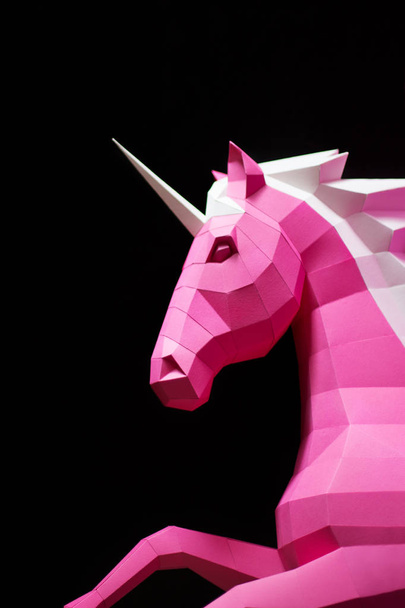 Paper unicorn head on a colored background. Geometry, bright and pastel colors. - Foto, Imagen